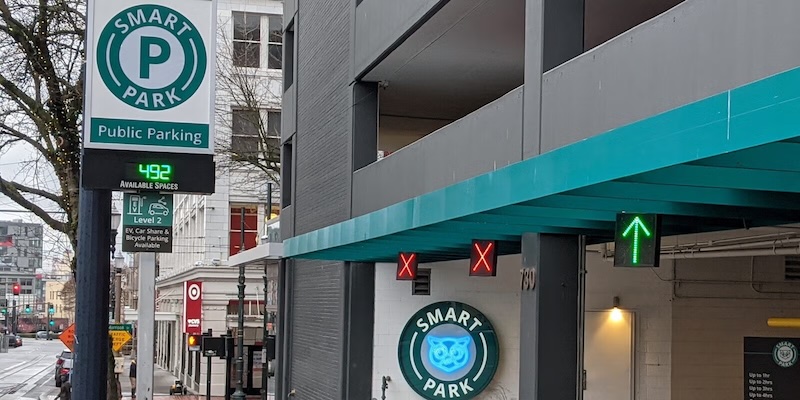 SmartPark garages are marked with teal signage containing a 'P' surrounded by 'Smart---Park', with 'Public Parking' underneath.